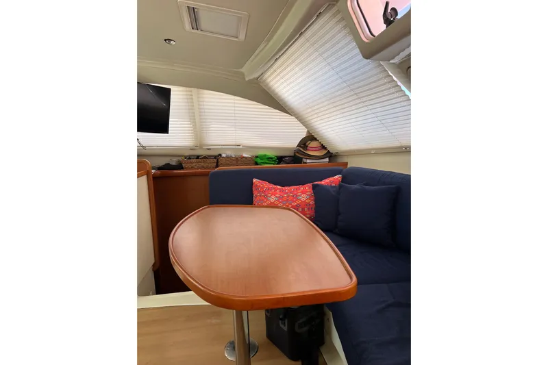  Yacht Photos Pics Interior of 2010 Leopard 40 yacht with cozy seating and wooden table.