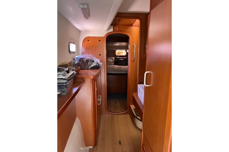  Yacht Photos Pics Interior of 2010 Leopard 40 yacht with wooden cabinetry and cozy sleeping area.