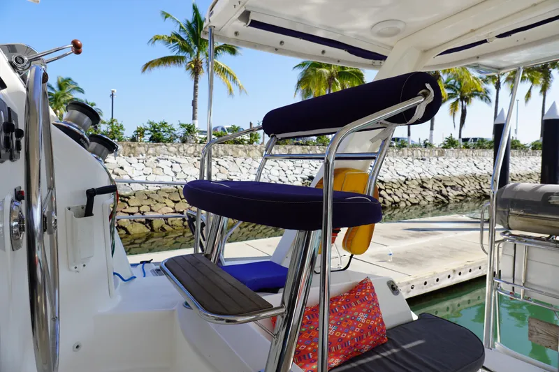  Yacht Photos Pics Helm station of 2010 Leopard 40 catamaran with tropical marina backdrop.
