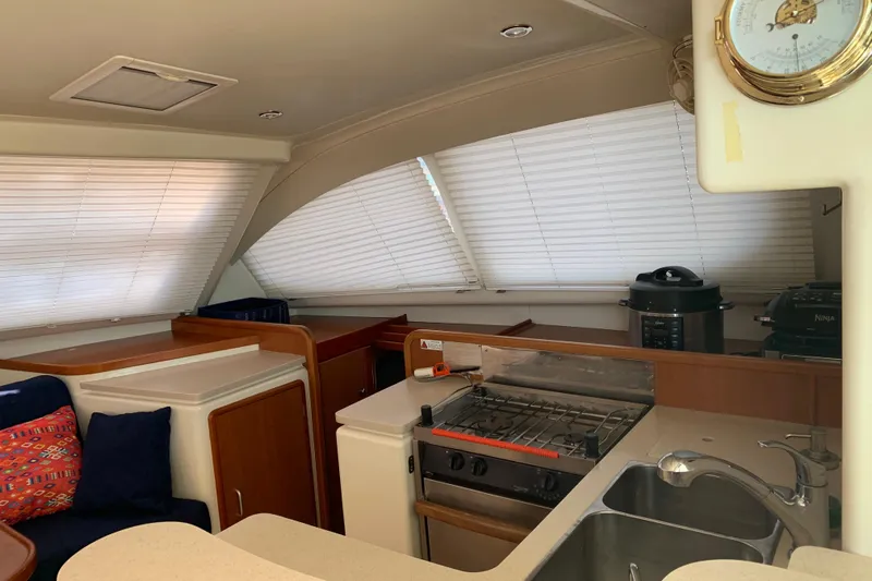  Yacht Photos Pics Interior of 2010 Leopard 40 catamaran kitchen with stove, sink, and appliances.