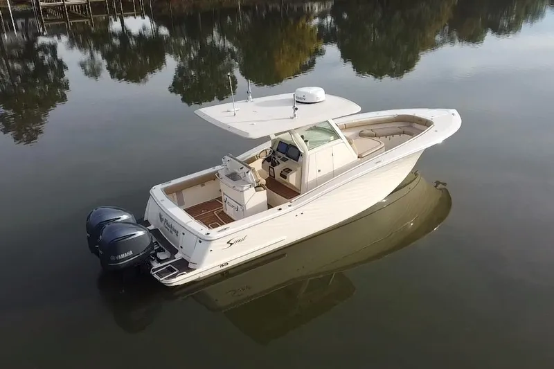  Yacht Photos Pics 2016 Scout 300 LXF boat with dual Yamaha engines on calm water.