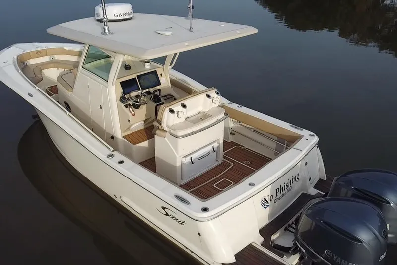  Yacht Photos Pics 2016 Scout 300 LXF boat with dual Yamaha engines on calm water.