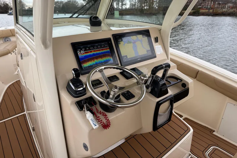  Yacht Photos Pics 2016 Scout 300 LXF boat helm with advanced navigation displays and controls.