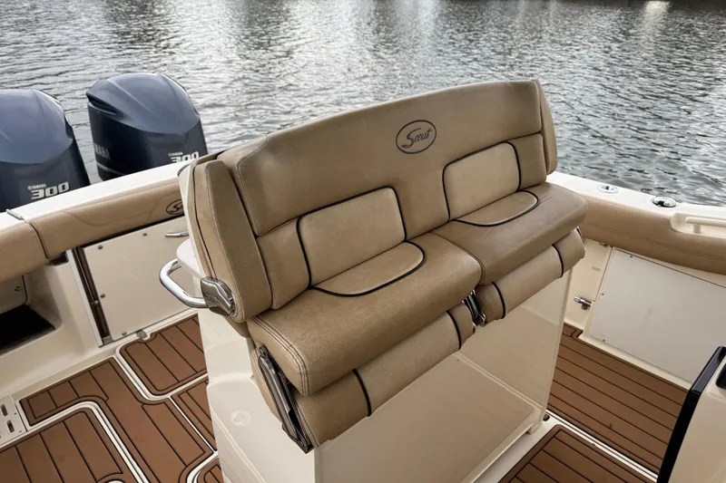  Yacht Photos Pics 2016 Scout 300 LXF boat interior with tan seating and twin Yamaha engines.