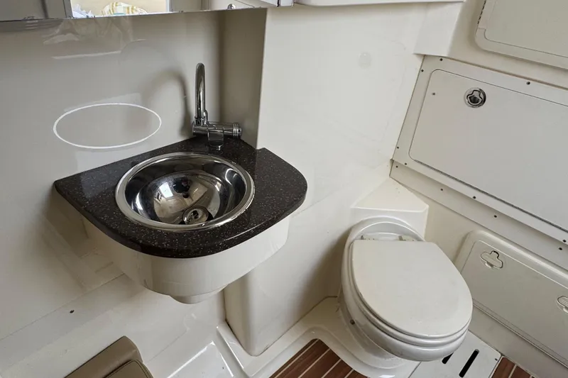  Yacht Photos Pics 2016 Scout 300 LXF boat bathroom with sink and toilet.