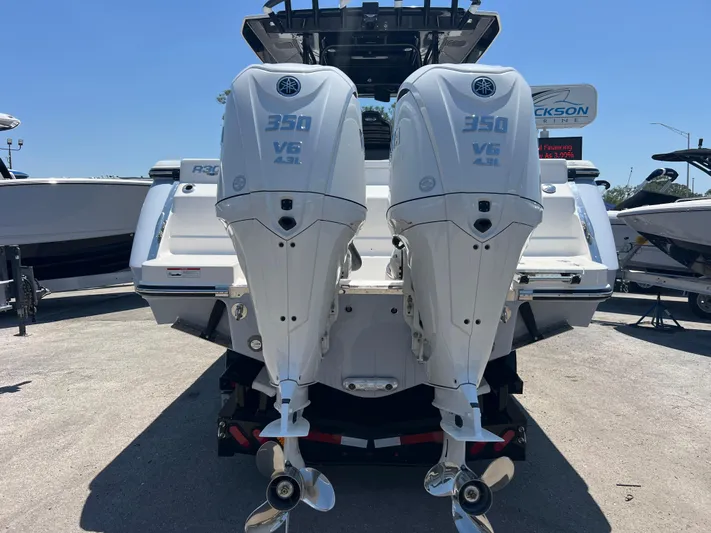 Yacht Photos Pics 2025 Robalo R300 Center Console with twin 350 V6 outboard engines, rear view.
