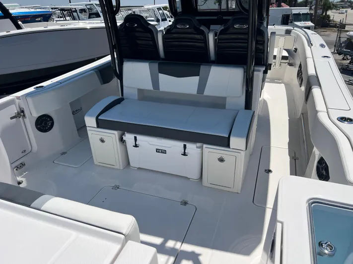  Yacht Photos Pics 2025 Robalo R300 Center Console boat interior with seating and storage.