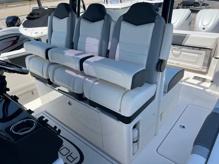  Yacht Photos Pics 2025 Robalo R300 Center Console boat with luxurious seating and modern design.