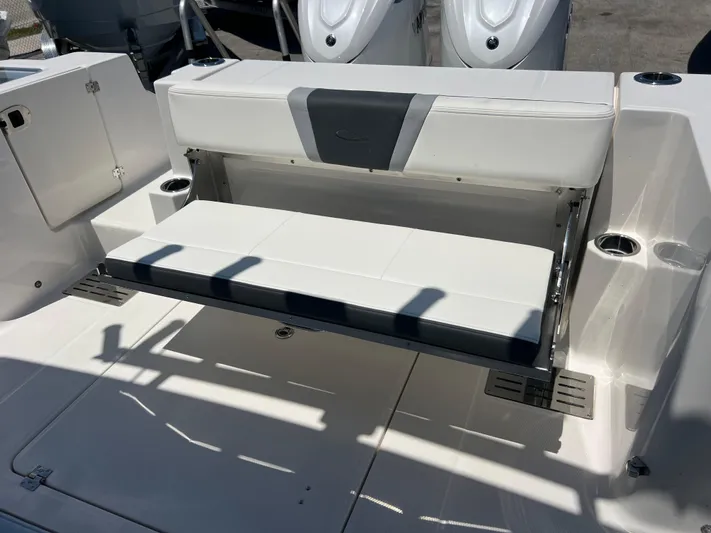  Yacht Photos Pics 2025 Robalo R300 Center Console boat with foldable rear seating and sleek design.