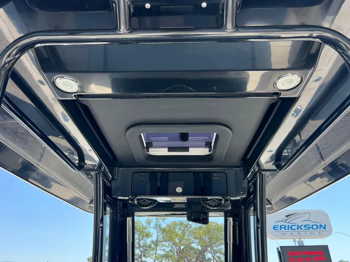  Yacht Photos Pics 2025 Robalo R300 Center Console boat roof with sleek design and integrated lighting.