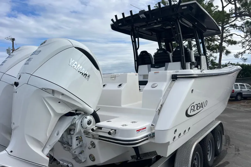  Yacht Photos Pics 2025 Robalo R300 Center Console boat with dual Yamaha engines on a trailer.