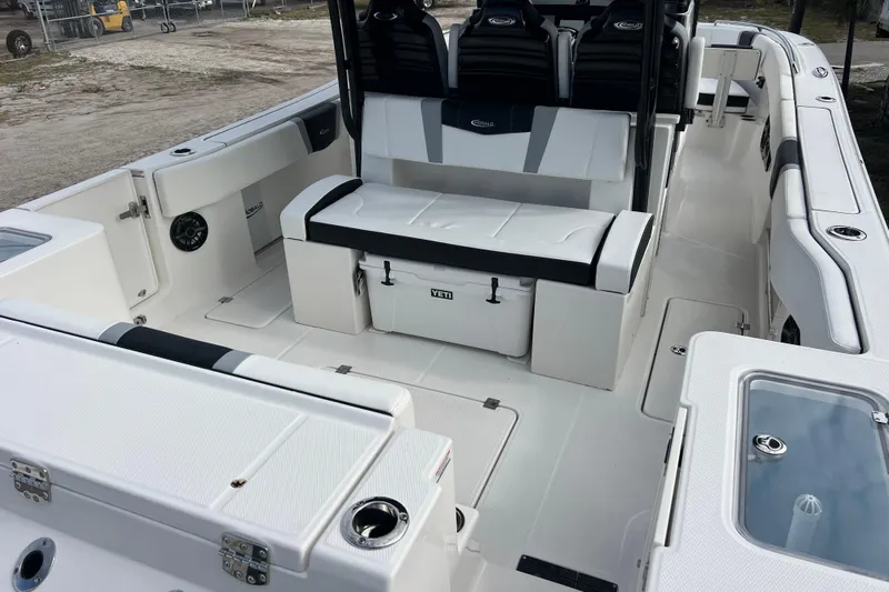  Yacht Photos Pics 2025 Robalo R300 Center Console boat interior with seating and storage compartments.