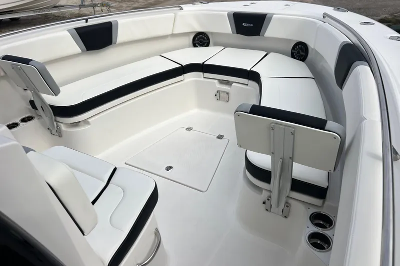  Yacht Photos Pics 2025 Robalo R300 Center Console boat interior with white seating and cup holders.