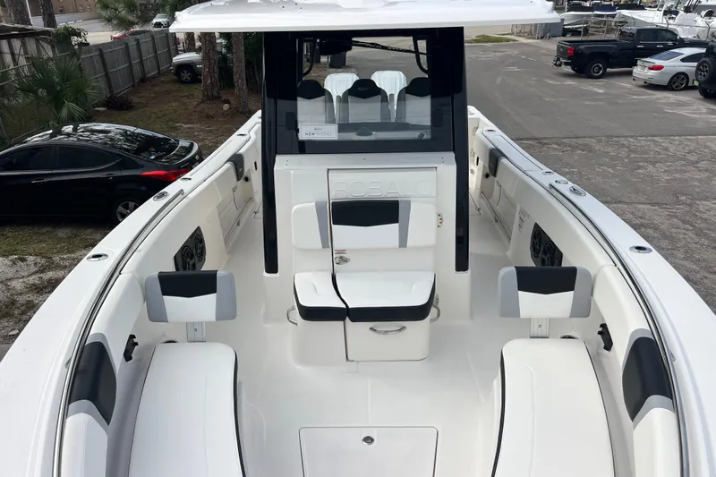  Yacht Photos Pics 2025 Robalo R300 Center Console boat with sleek white interior and seating.
