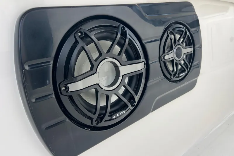  Yacht Photos Pics Speakers on 2025 Robalo R300 Center Console boat, featuring sleek black design.