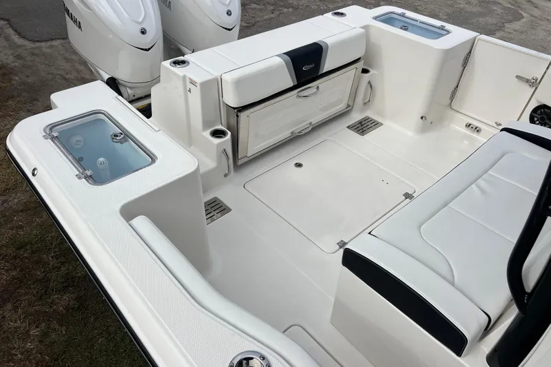  Yacht Photos Pics 2025 Robalo R300 Center Console boat interior with seating and storage compartments.