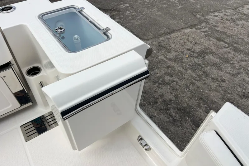  Yacht Photos Pics 2025 Robalo R300 Center Console boat deck with storage and livewell.