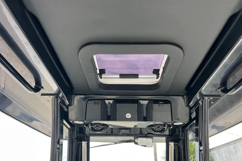  Yacht Photos Pics 2025 Robalo R300 Center Console boat interior roof with hatch and speakers.