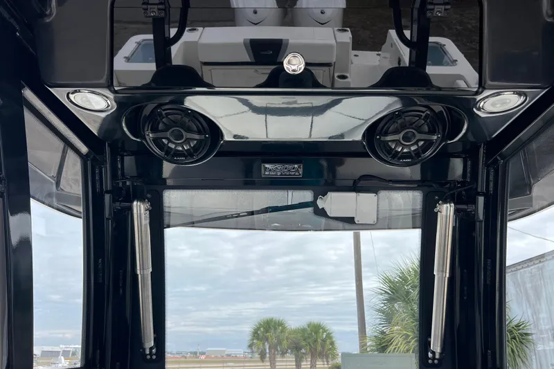  Yacht Photos Pics 2025 Robalo R300 Center Console interior with speakers and modern design.