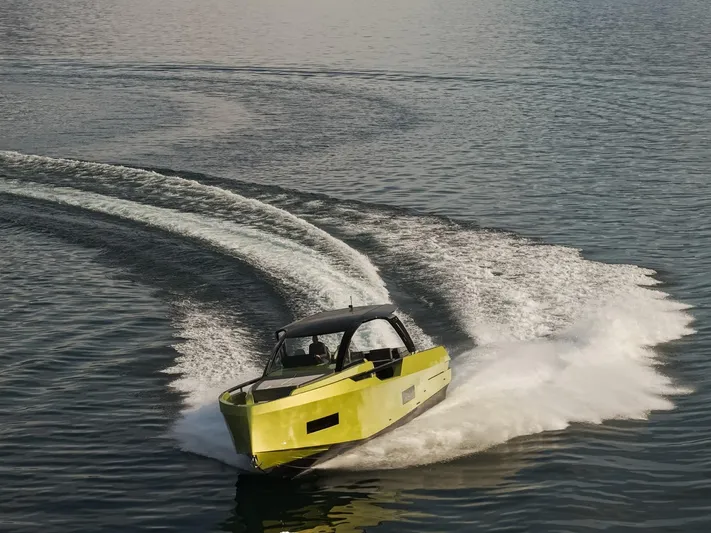  Yacht Photos Pics 2025 Blu Martin Yachts WALK AROUND 46 cruising on open water, creating dynamic wake patterns.