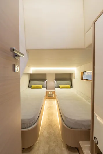  Yacht Photos Pics Interior cabin of 2025 Blu Martin Yachts WALK AROUND 46 with twin beds and modern lighting.
