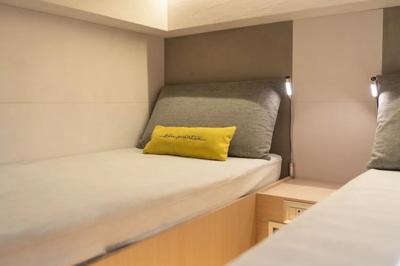 Yacht Photos Pics 2025 Blu Martin Yachts WALK AROUND 46 cabin with modern twin beds and ambient lighting.