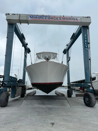 Farmers Daughter Yacht Photos Pics 2004 Viking 45 Convertible yacht at Two Georges Marina, lifted by boat hoist.