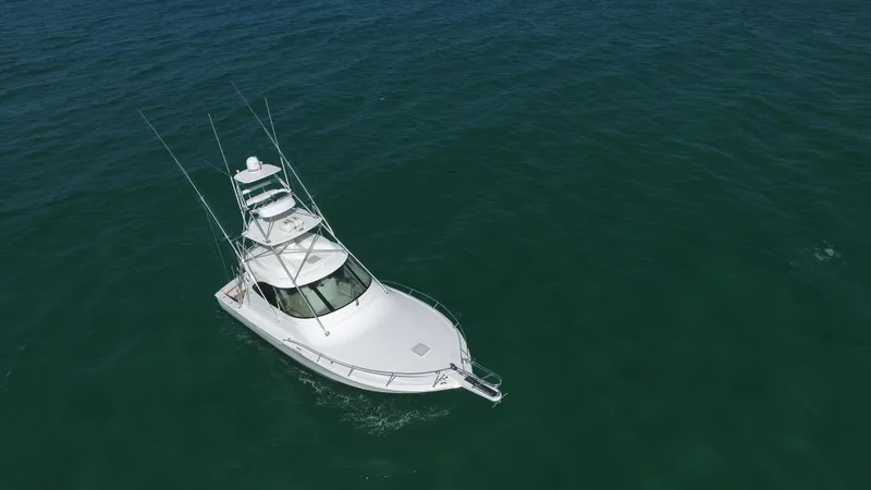 Brown Eyed Girl Yacht Photos Pics 2014 Viking 42 Sport Tower yacht cruising on open sea.