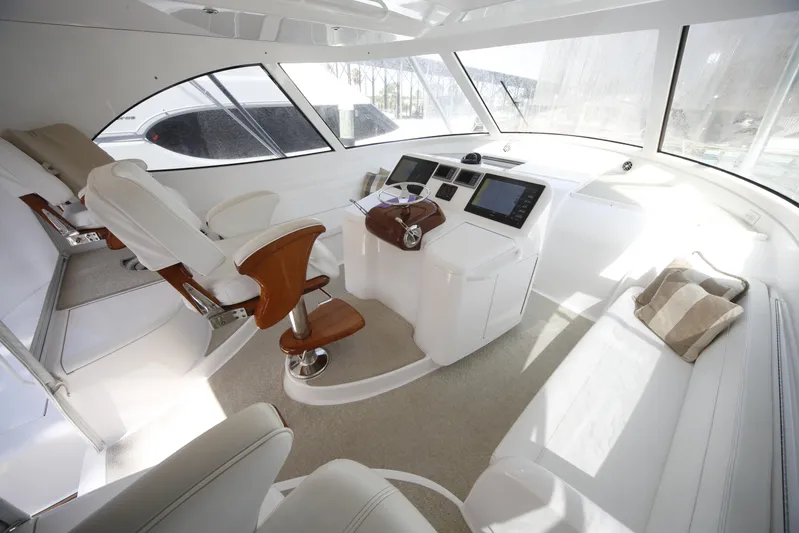 Brown Eyed Girl Yacht Photos Pics Interior of 2014 Viking 42 Sport Tower yacht with modern helm and seating.