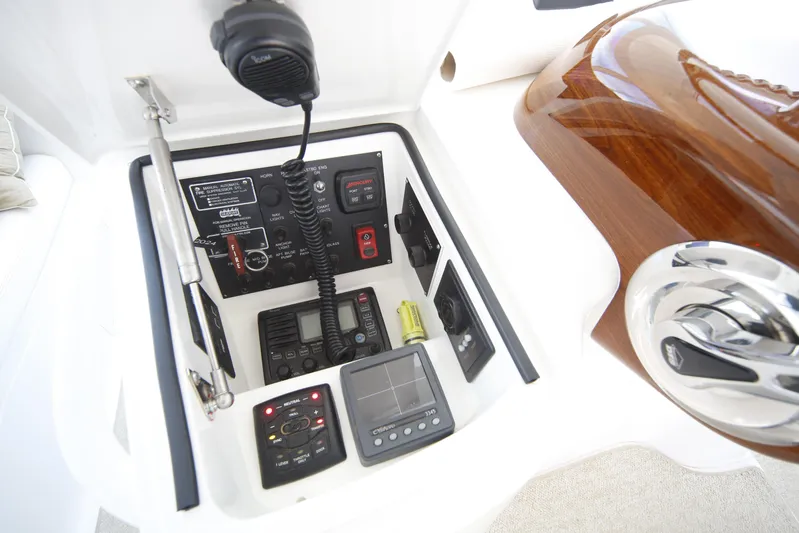 Brown Eyed Girl Yacht Photos Pics Control panel of 2014 Viking 42 Sport Tower with communication and navigation equipment.