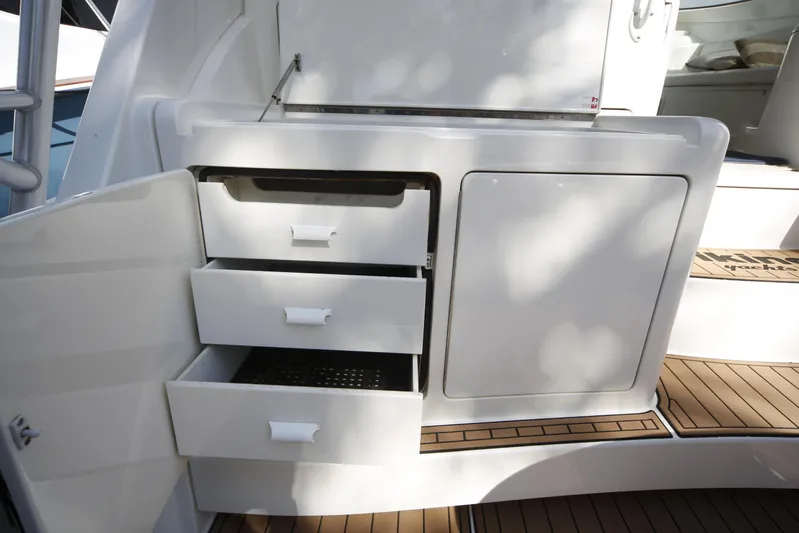 Brown Eyed Girl Yacht Photos Pics 2014 Viking 42 Sport Tower yacht with open storage drawers and sleek white cabinetry.