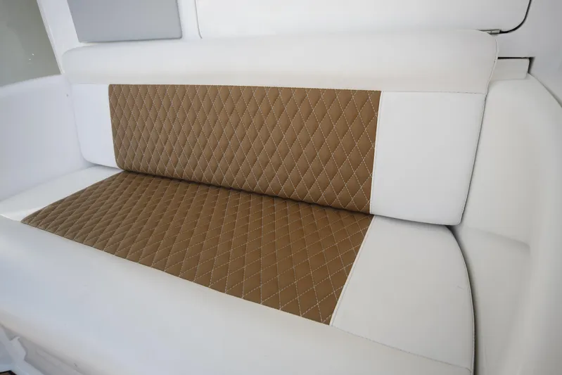 Brown Eyed Girl Yacht Photos Pics 2014 Viking 42 Sport Tower interior seating with quilted brown and white upholstery.