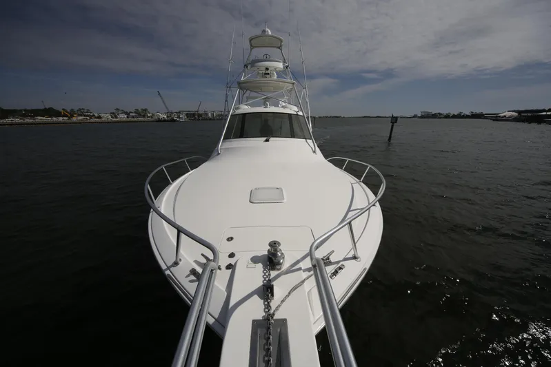 Brown Eyed Girl Yacht Photos Pics 2014 Viking 42 Sport Tower yacht on calm water, viewed from the bow.