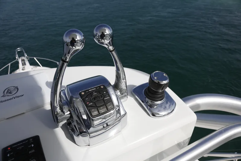 Brown Eyed Girl Yacht Photos Pics Control panel of a 2014 Viking 42 Sport Tower boat with chrome levers.