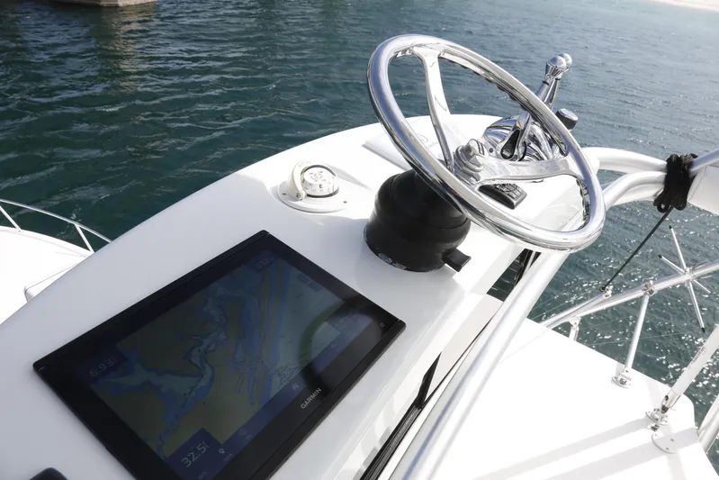 Brown Eyed Girl Yacht Photos Pics 2014 Viking 42 Sport Tower helm with steering wheel and navigation display.