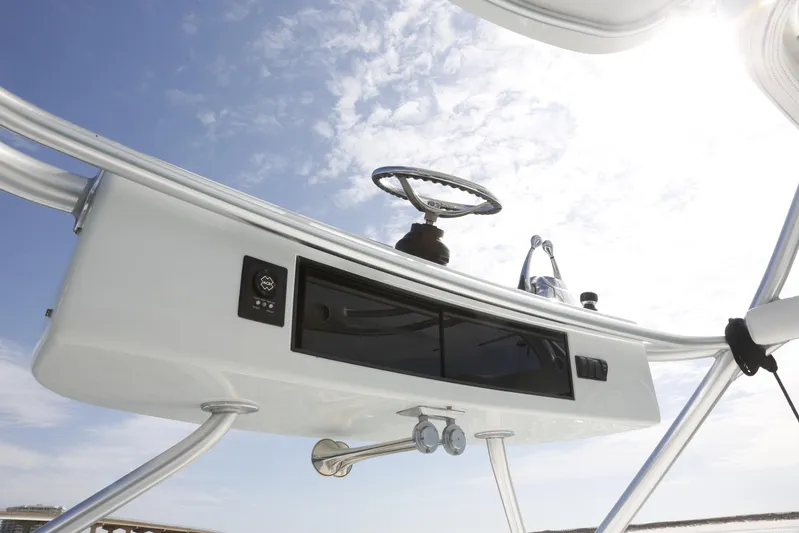 Brown Eyed Girl Yacht Photos Pics 2014 Viking 42 Sport Tower helm station with steering wheel and controls under clear sky.