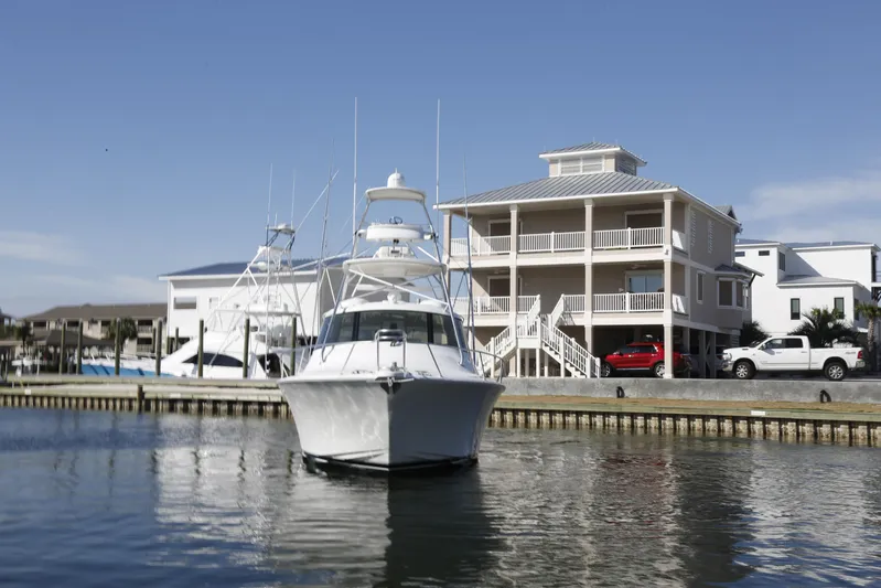 Brown Eyed Girl Yacht Photos Pics 2014 Viking 42 Sport Tower yacht docked near waterfront homes.