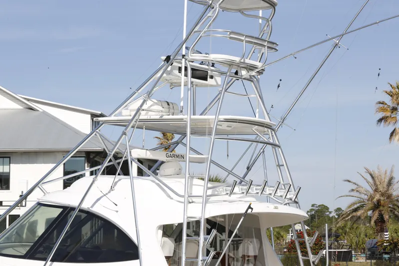 Brown Eyed Girl Yacht Photos Pics 2014 Viking 42 Sport Tower yacht with tower, docked near palm trees.