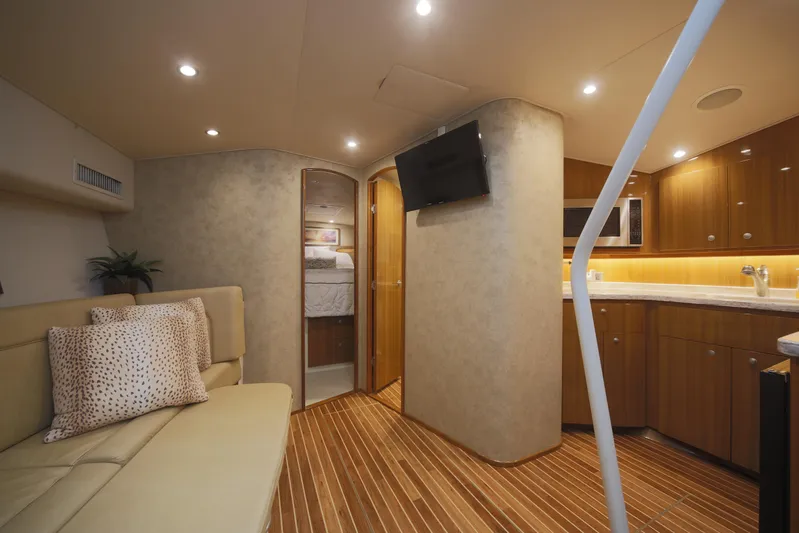 Brown Eyed Girl Yacht Photos Pics Interior of 2014 Viking 42 Sport Tower yacht with modern kitchen and cozy seating area.