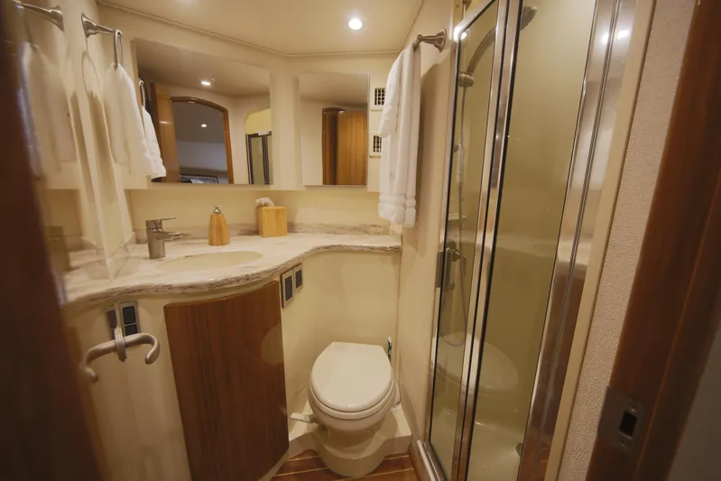 Brown Eyed Girl Yacht Photos Pics Luxurious bathroom in 2014 Viking 42 Sport Tower yacht with modern amenities.