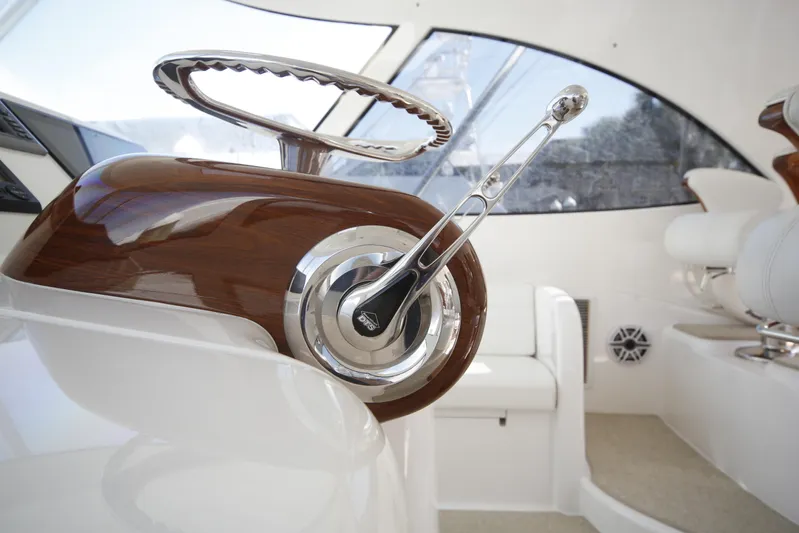 Brown Eyed Girl Yacht Photos Pics 2014 Viking 42 Sport Tower helm with polished wood and chrome controls.
