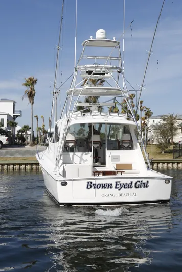 Brown Eyed Girl Yacht Photos Pics 2014 Viking 42 Sport Tower boat named "Brown Eyed Girl" in a marina setting.