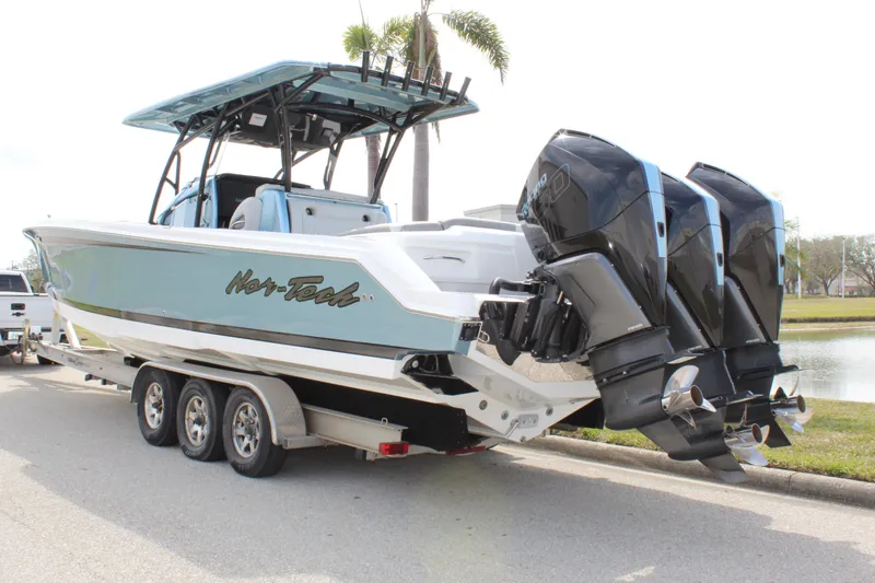  Yacht Photos Pics 2021 Nor-Tech 390 Sport Center Console boat on trailer with triple outboard engines.