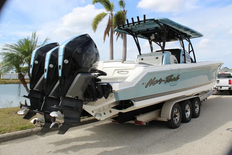  Yacht Photos Pics 2021 Nor-Tech 390 Sport Center Console boat with triple engines on a trailer.
