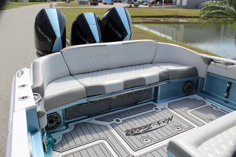  Yacht Photos Pics 2021 Nor-Tech 390 Sport Center Console boat with triple outboard engines and luxurious seating.