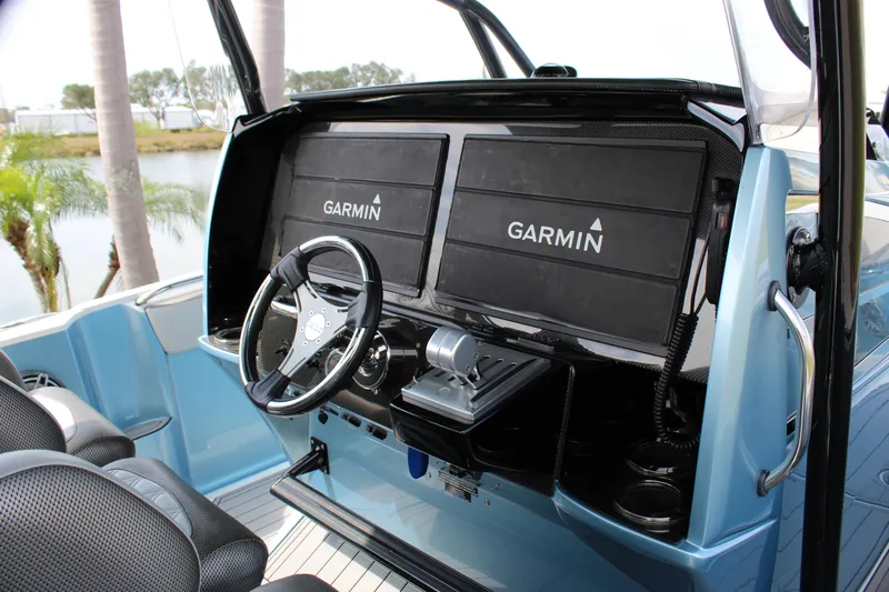  Yacht Photos Pics 2021 Nor-Tech 390 Sport Center Console with dual Garmin displays and sleek steering wheel.