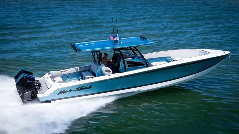  Yacht Photos Pics 2021 Nor-Tech 390 Sport Center Console boat cruising on open water.