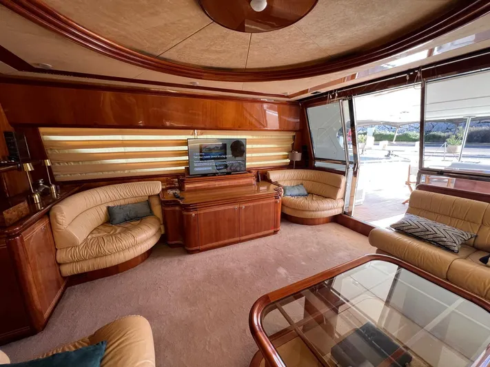  Yacht Photos Pics Luxurious interior of 2002 Ferretti Yachts 810 with elegant seating and entertainment area.
