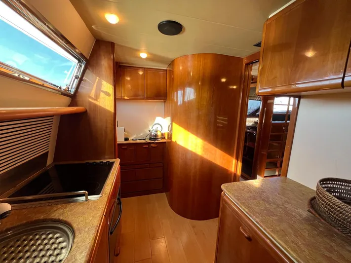  Yacht Photos Pics Luxurious 2002 Ferretti Yachts 810 interior with elegant wood finishes and modern amenities.