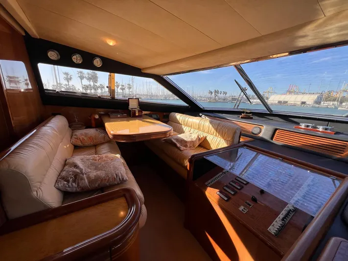  Yacht Photos Pics Luxurious interior of 2002 Ferretti Yachts 810 with plush seating and panoramic windows.